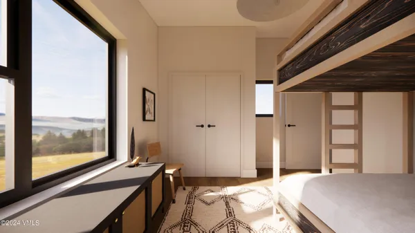 a bedroom with a bed and a large window with outer view