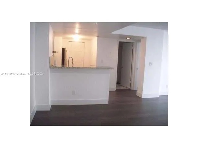 a room with a bench and a vanity