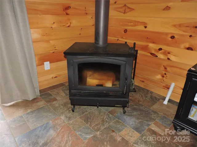 a room with furniture pool table and windows