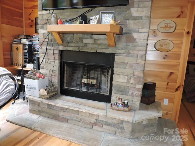 a room with fireplace and a two windows