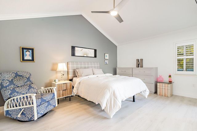 a spacious bedroom with a bed and a couch