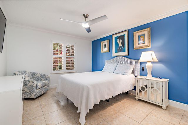 a bedroom with bed and window