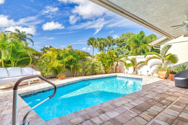 a view of a swimming pool with a patio