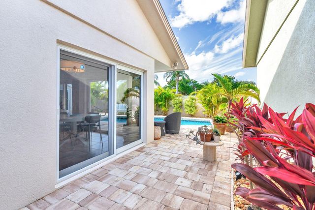 a lobby with chair and glass door