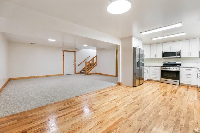 605 North Loafer Canyon Road Elk Ridge, UT 84651 - Photo 25 of 53 Basement kitchen and rec room