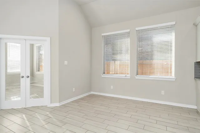 a view of an empty room with a window