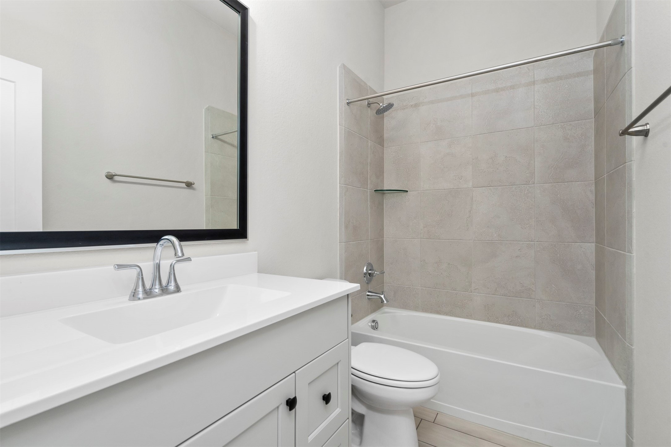 107 Yellow Perch Way Conroe, TX 77318 - Photo 16 of 36 a bathroom with a sink a toilet and shower
