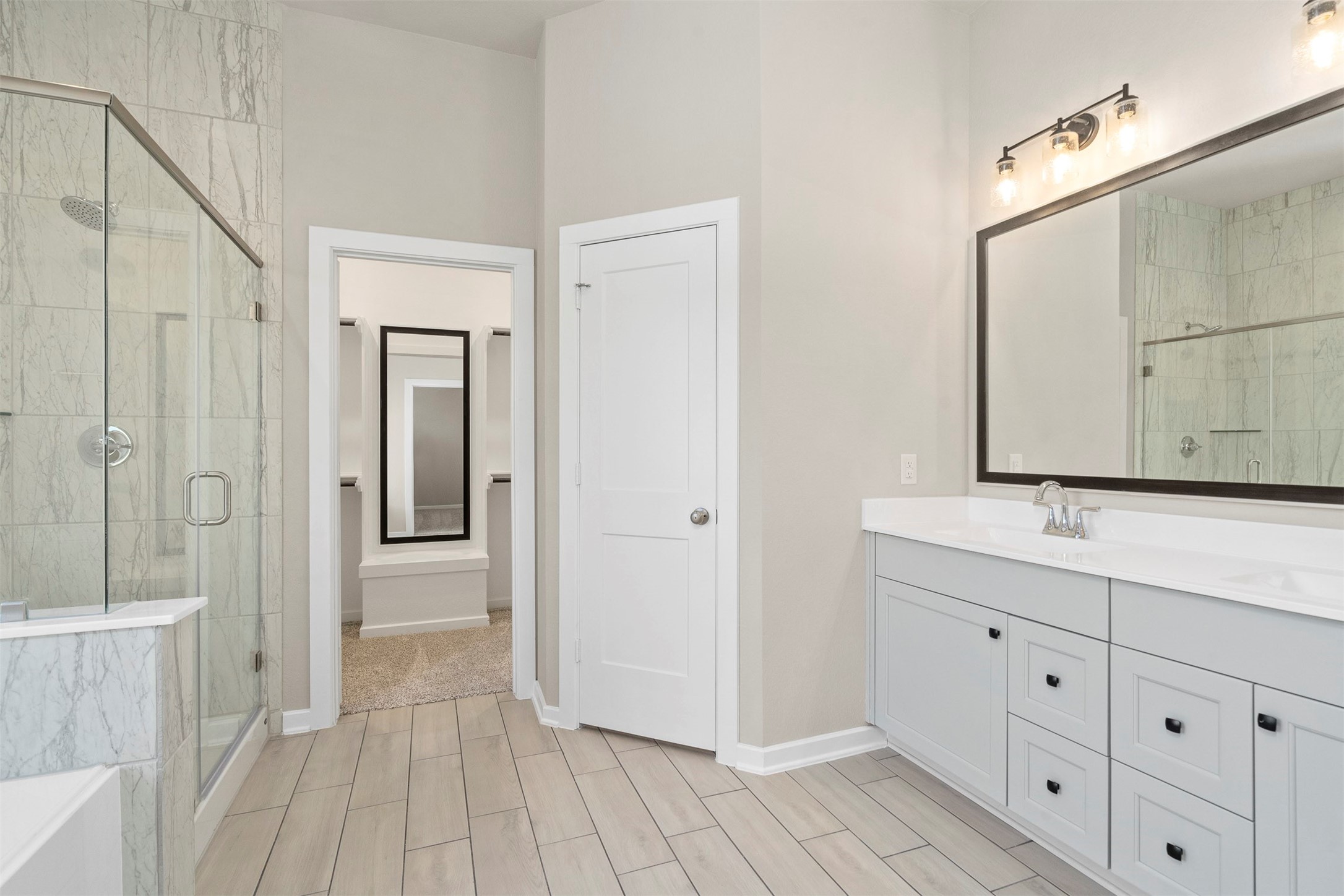 107 Yellow Perch Way Conroe, TX 77318 - Photo 21 of 36 a bathroom with a double vanity sink and mirror