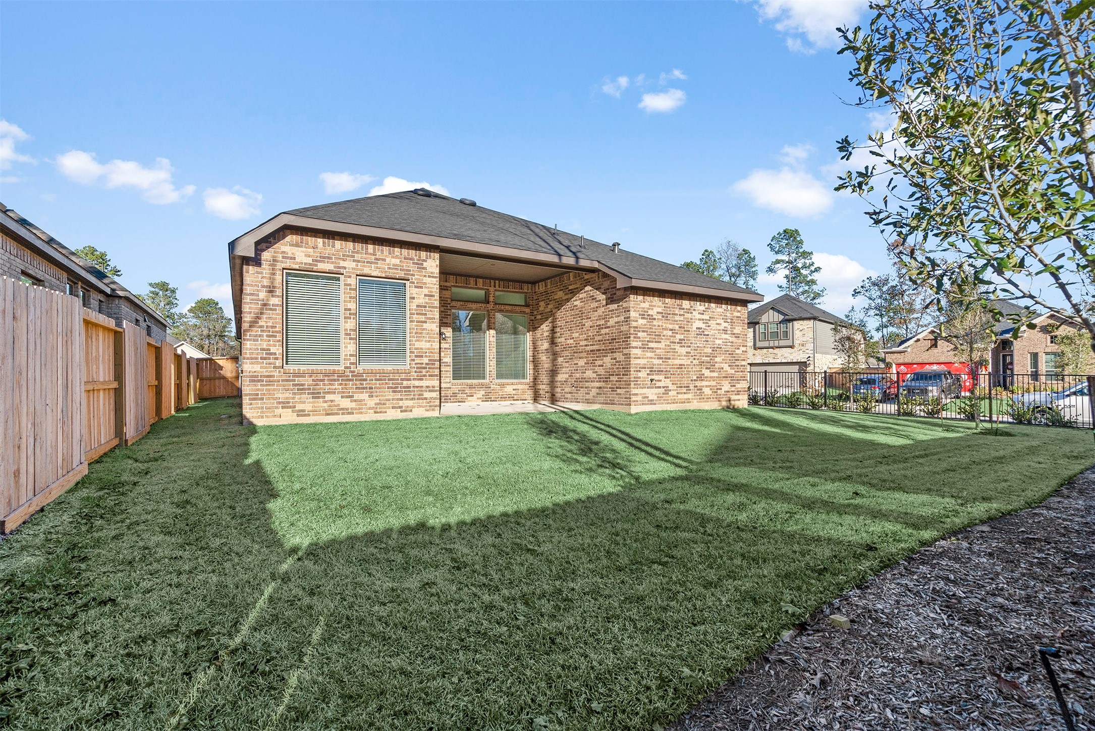 107 Yellow Perch Way Conroe, TX 77318 - Photo 25 of 36 a front view of a house with garden