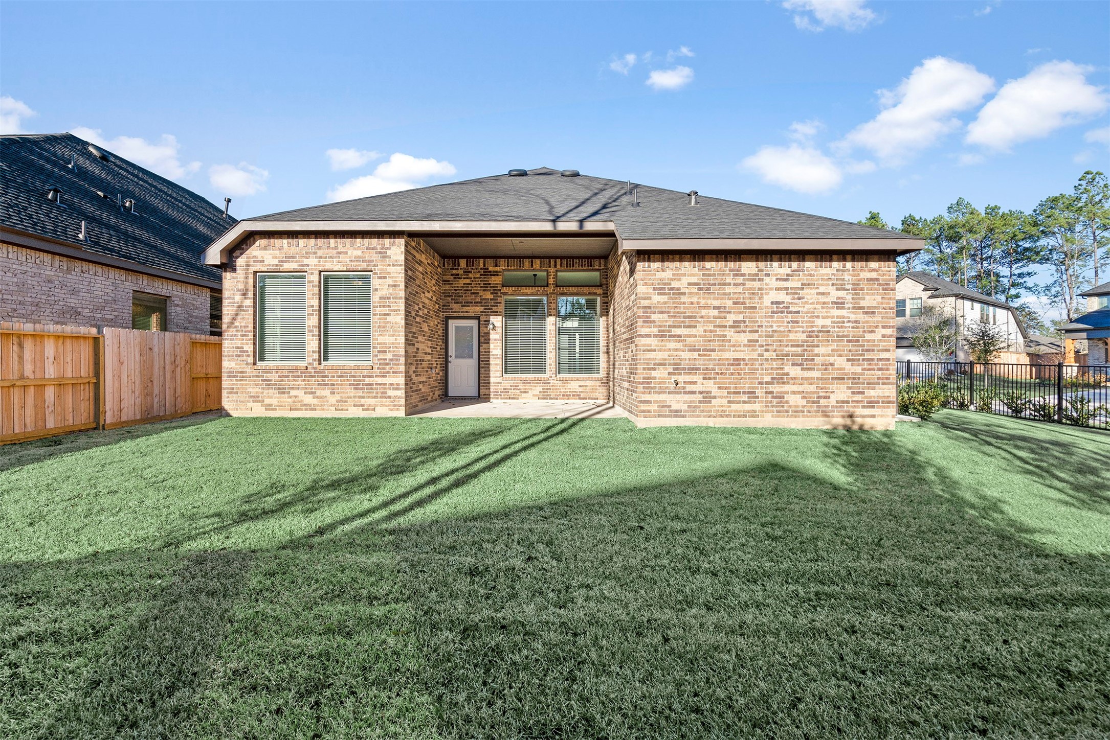 107 Yellow Perch Way Conroe, TX 77318 - Photo 26 of 36 a view of a house with a backyard