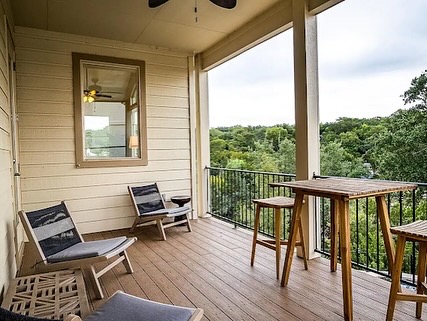 16308 Lake Loop Austin, TX 78734 - Photo 3 of 11 a view of a balcony with furniture and wooden floor