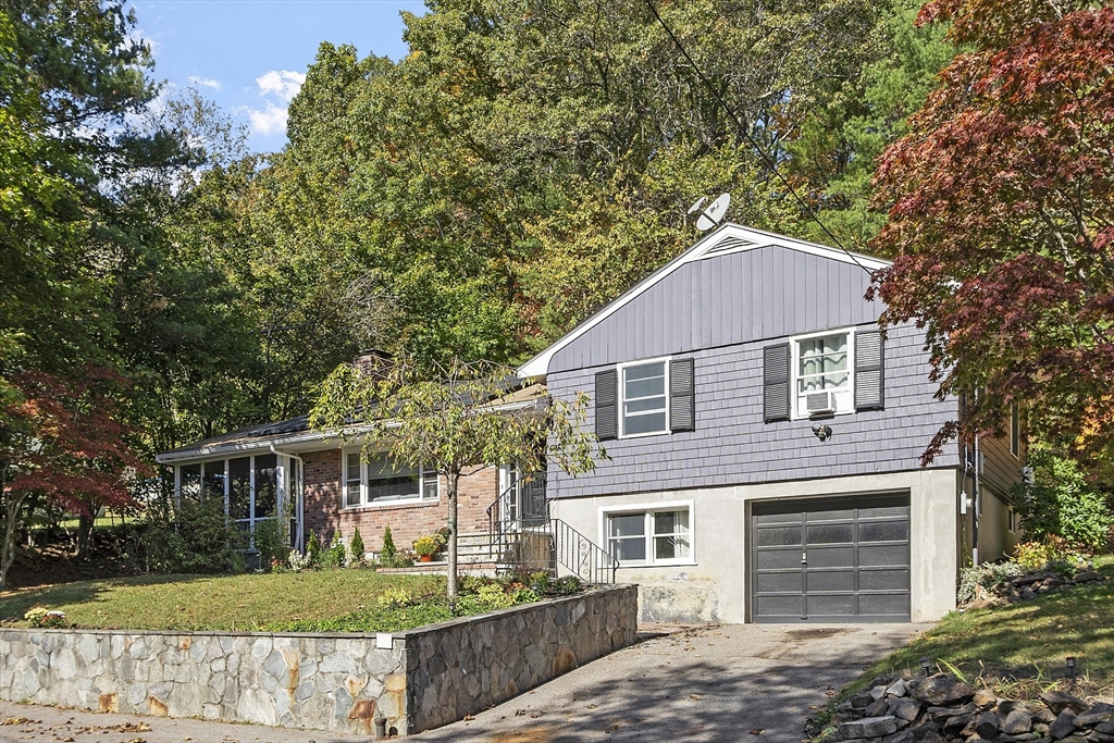 47 Summer Hill Road Maynard, MA 01754 - Photo 1 of 42 a front view of a house with a yard