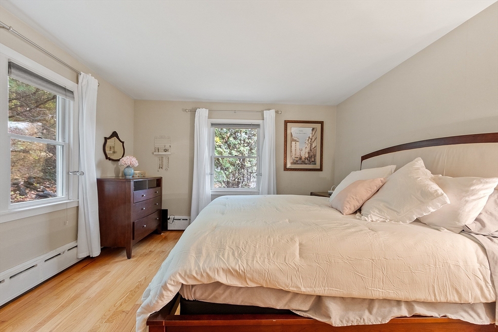 47 Summer Hill Road Maynard, MA 01754 - Photo 14 of 42 a bedroom with a bed and wooden floor