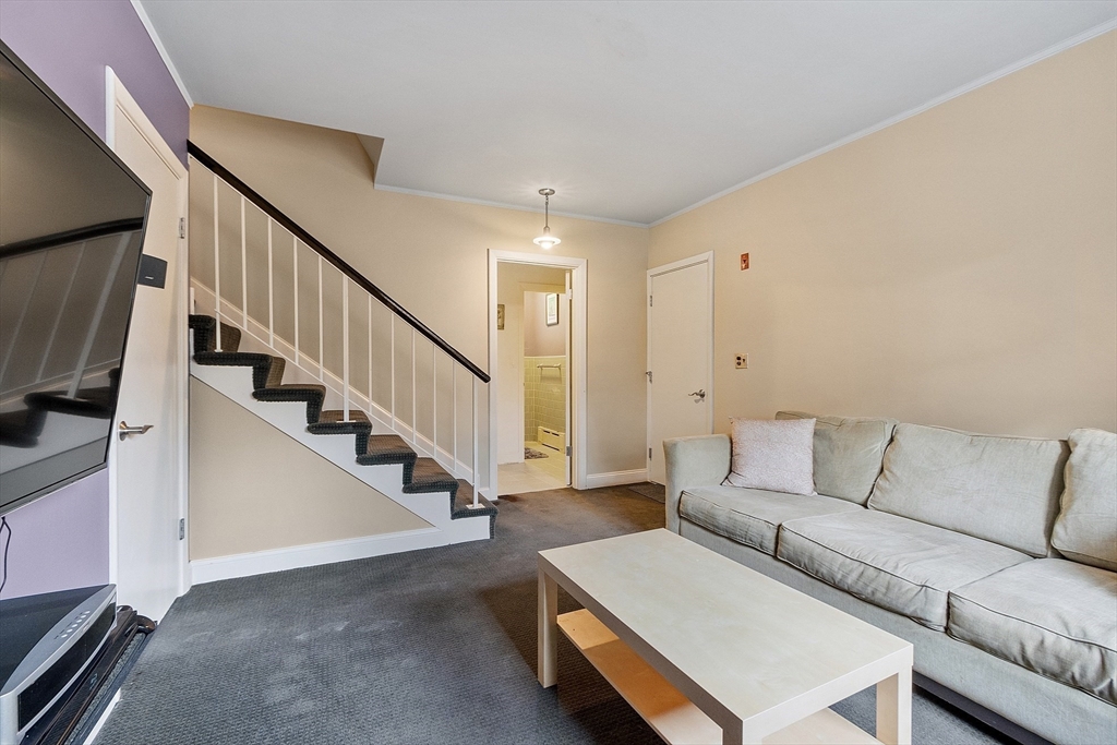 47 Summer Hill Road Maynard, MA 01754 - Photo 29 of 42 a living room with furniture and a flat screen tv
