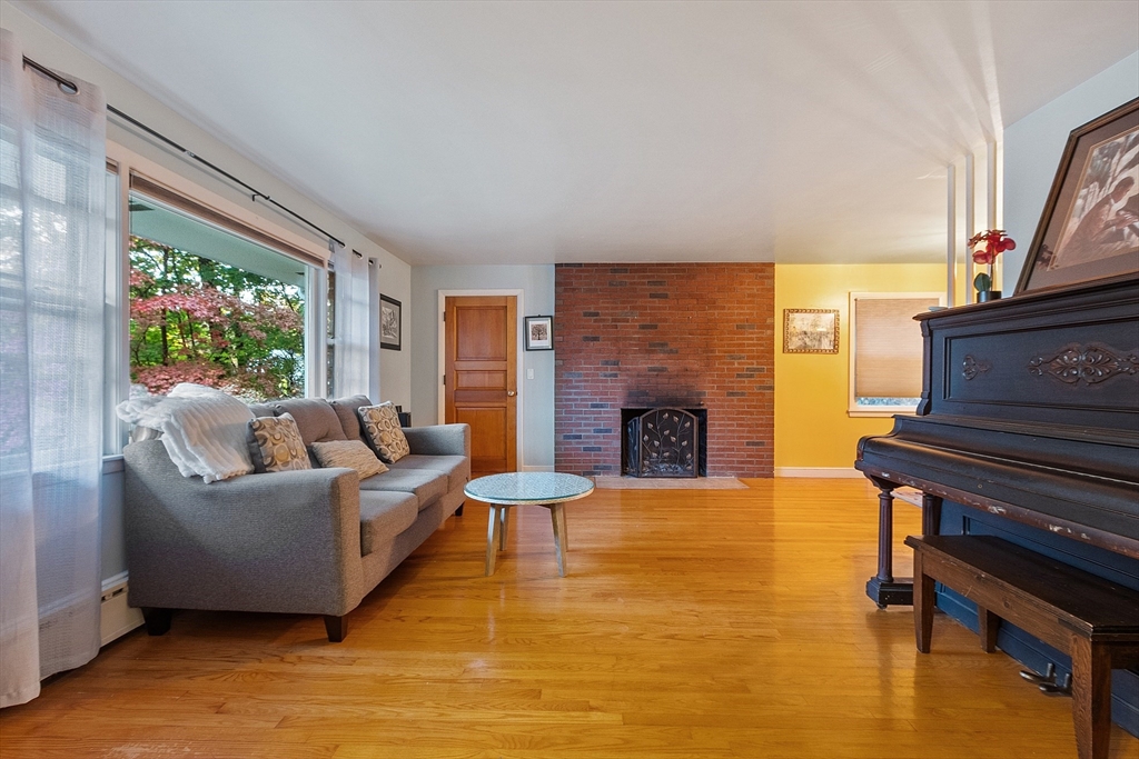 47 Summer Hill Road Maynard, MA 01754 - Photo 3 of 42 a living room with furniture and a fireplace