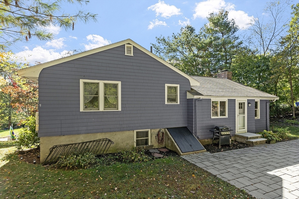 47 Summer Hill Road Maynard, MA 01754 - Photo 34 of 42 a backyard of a house with seating space