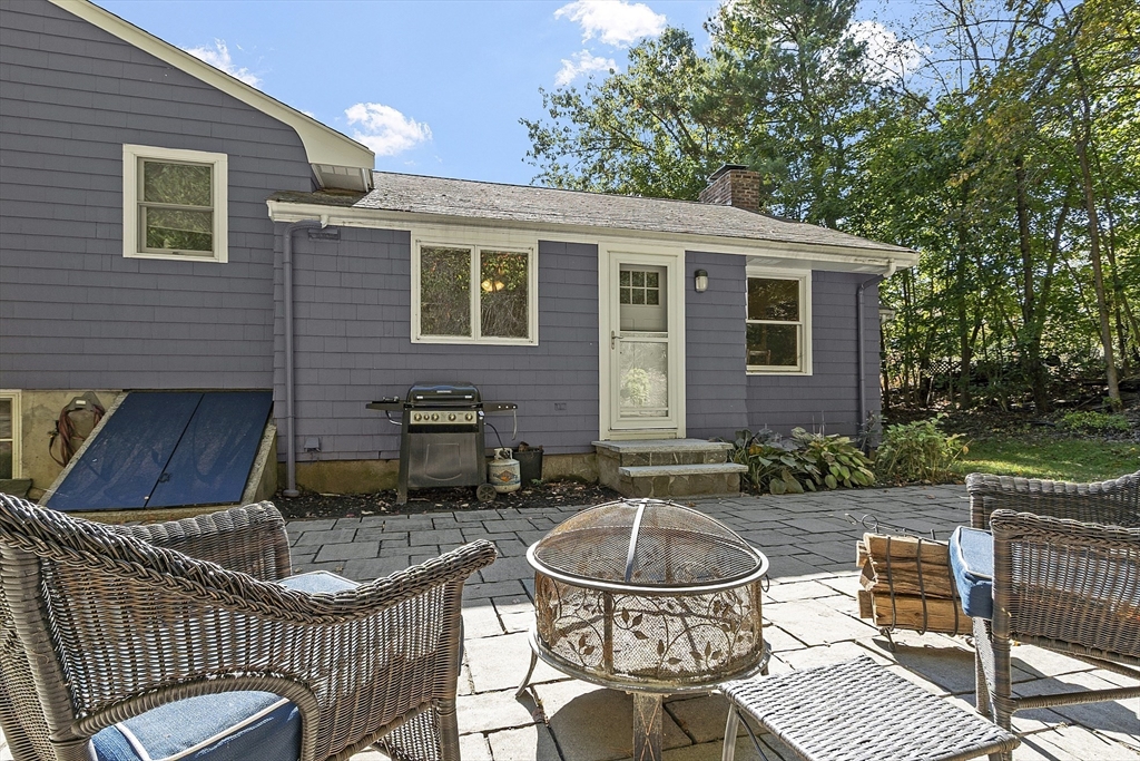 47 Summer Hill Road Maynard, MA 01754 - Photo 37 of 42 a view of house with backyard outdoor seating and green space