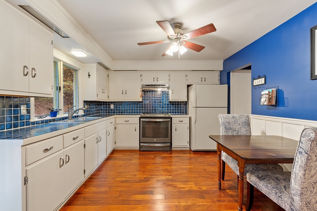 47 Summer Hill Road Maynard, MA 01754 - Photo 7 of 42 a kitchen with stainless steel appliances granite countertop a stove refrigerator and a sink