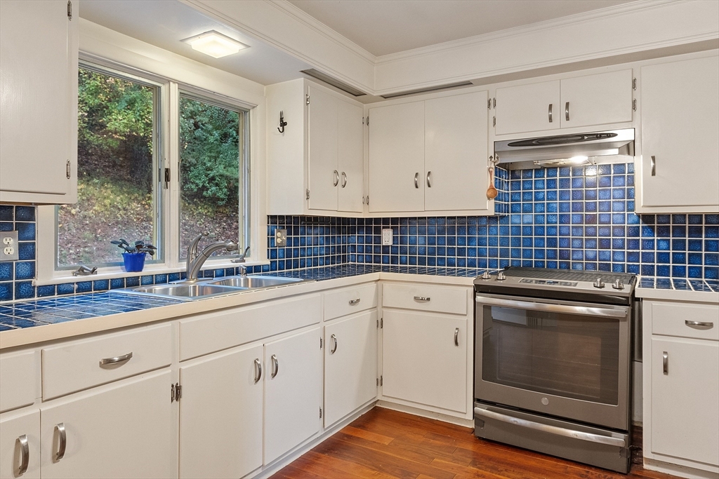 47 Summer Hill Road Maynard, MA 01754 - Photo 8 of 42 a kitchen with appliances cabinets and a sink