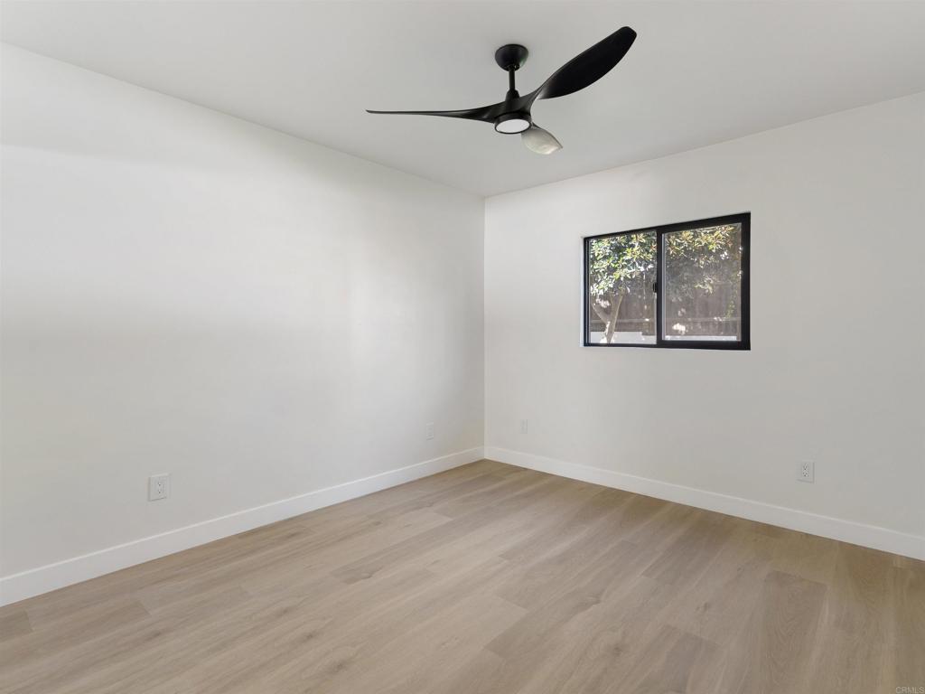 1482 Avocado Road Oceanside, CA 92054 - Photo 13 of 35 a view of empty room with wooden floor