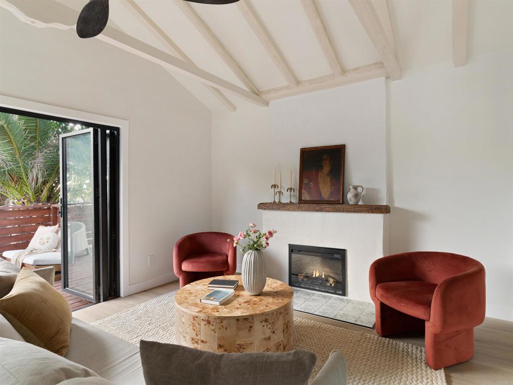 1482 Avocado Road Oceanside, CA 92054 - Photo 21 of 35 a living room with furniture and a fireplace