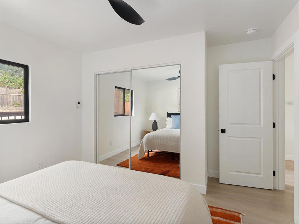 1482 Avocado Road Oceanside, CA 92054 - Photo 29 of 35 a bedroom with a bed and a lamp