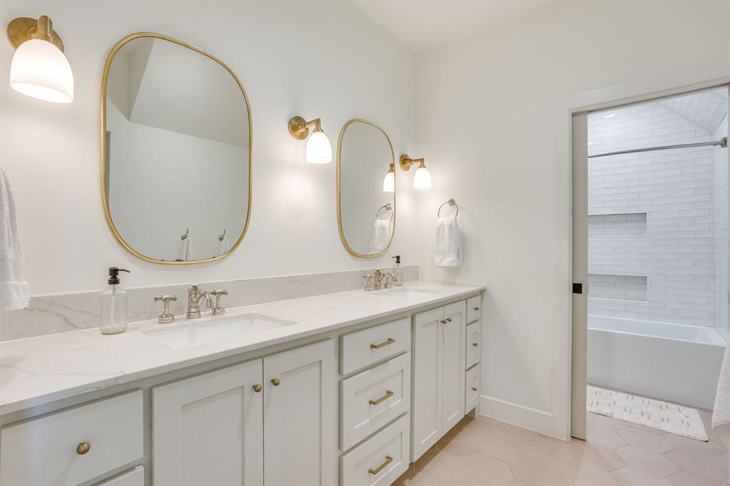 14000 Rozana Street Fort Worth, TX 76008 - Photo 27 of 38 a bathroom with a double vanity sink and a mirror