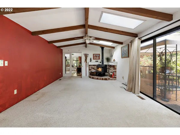 a view of empty room with large windows