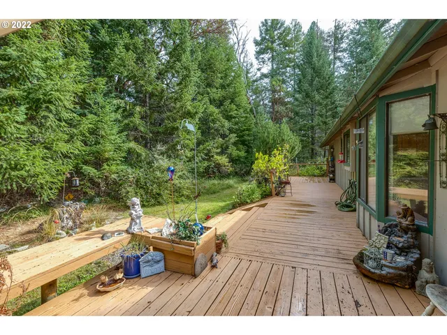 a view of a backyard with sitting area