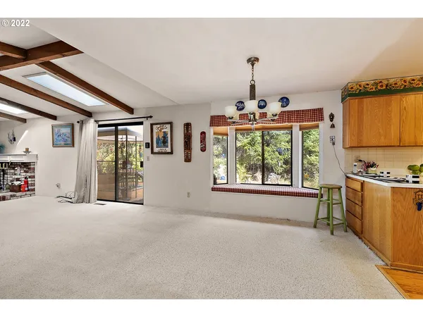 a big room with chandelier and windows