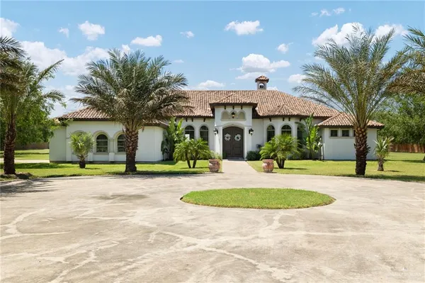 a view of a house with basketball court