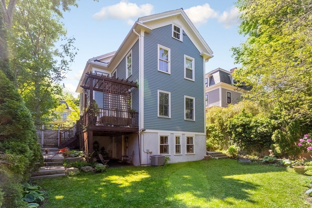 99 Upland Road Cambridge, MA 02140 - Photo 15 of 16 a view of a house with a yard and plants