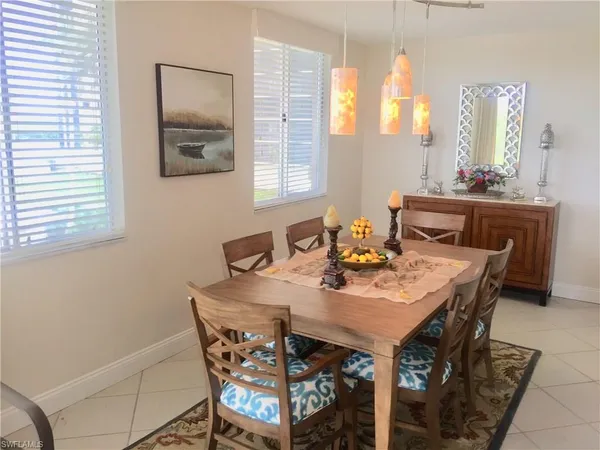 a view of a dining room with furniture and window