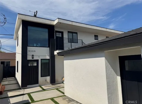 a view of a backyard with sitting area