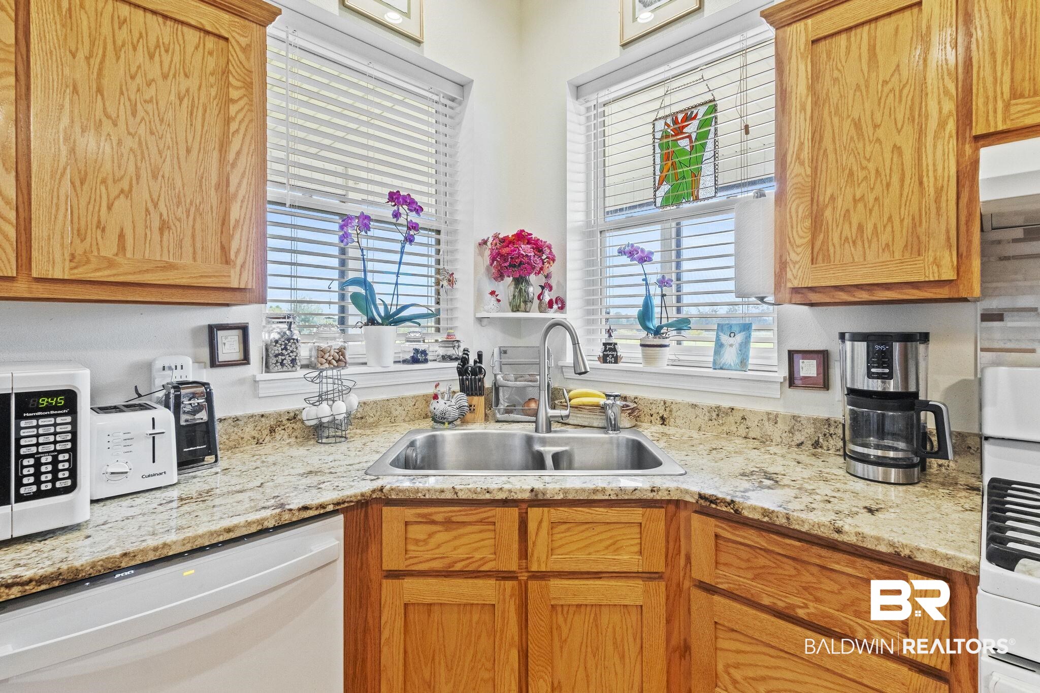 26071 Woerner Road Elberta, AL 36530 - Photo 14 of 86 Kitchen with light stone counters, white appliances, a sink, and a wealth of natural light