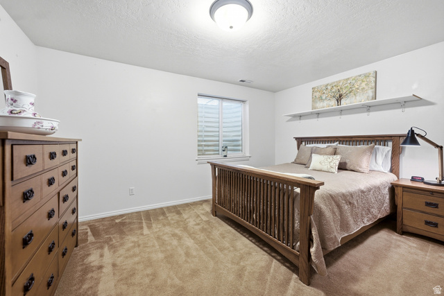5196 Rodeo Circle Oakley, UT 84055 - Photo 34 of 57 Carpeted room featuring a window with horizontal blinds, white baseboards, and a semi-flush mount ceiling light fixture