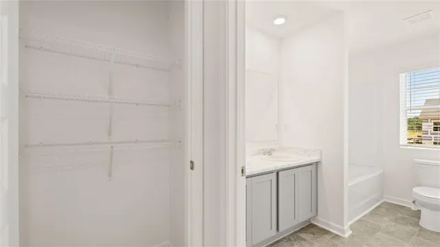 a bathroom with a sink and toilet