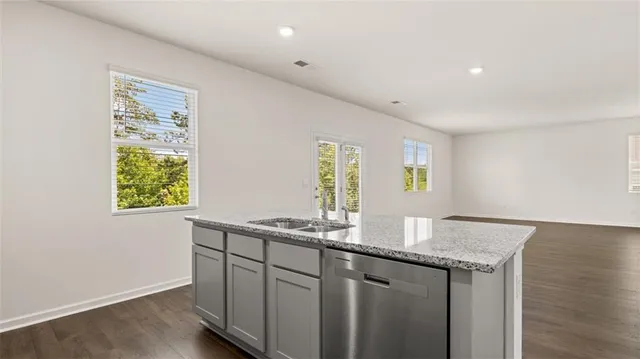 a kitchen with a sink and a window