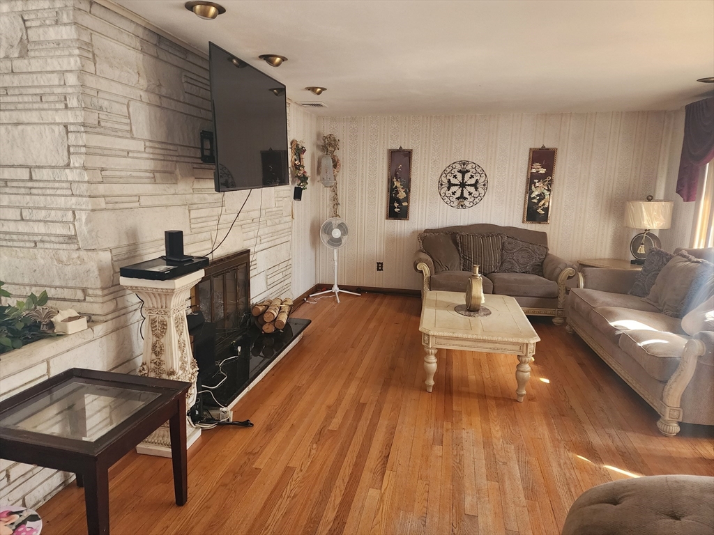 590 Plumtree Road Springfield, MA 01118 - Photo 4 of 19 a living room with furniture and a wooden floor