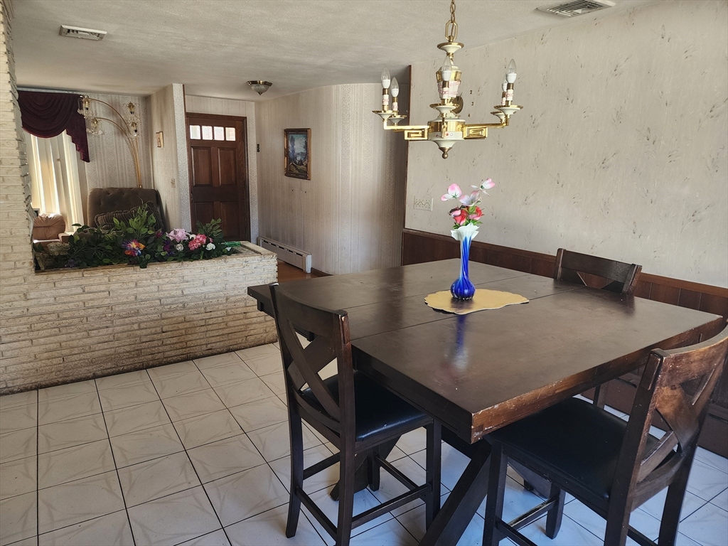 590 Plumtree Road Springfield, MA 01118 - Photo 6 of 19 a view of a dining room with furniture and chandelier