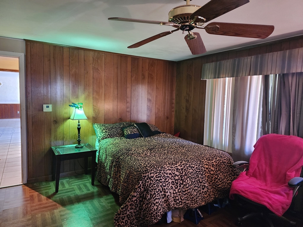 590 Plumtree Road Springfield, MA 01118 - Photo 8 of 19 a bed room with a bed and a chair