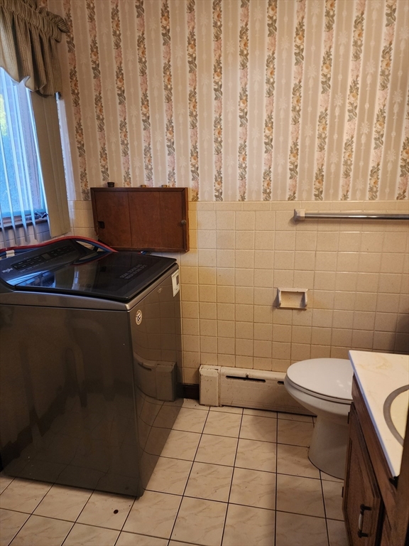 590 Plumtree Road Springfield, MA 01118 - Photo 9 of 19 a bathroom with a sink a toilet and a mirror