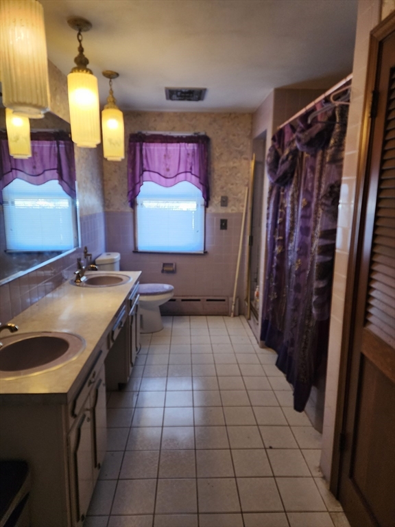 590 Plumtree Road Springfield, MA 01118 - Photo 10 of 19 a kitchen with stainless steel appliances granite countertop a sink and a refrigerator