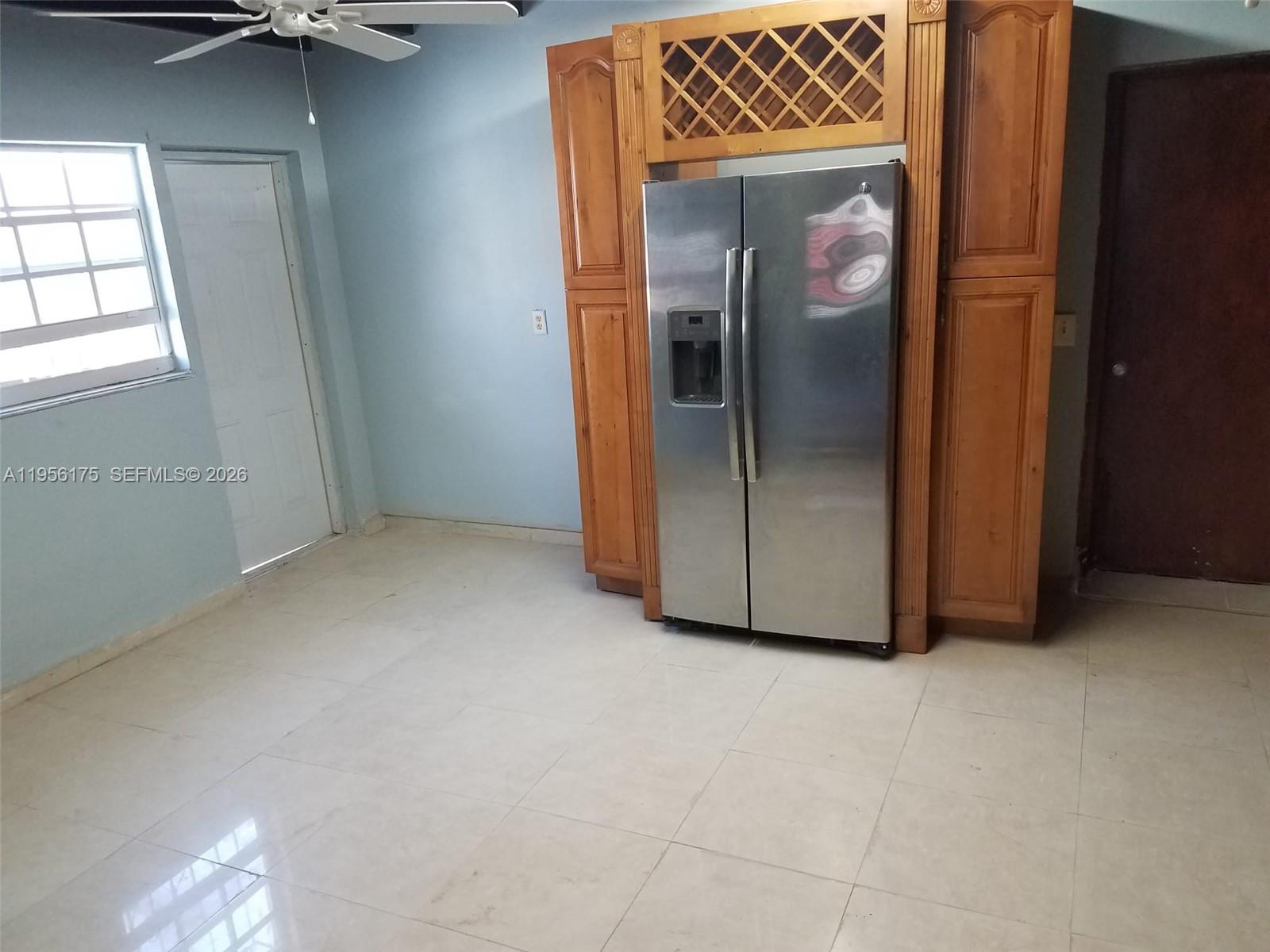 2828 Southwest 3rd Street, Unit FRONT Miami, FL 33135 - Photo 6 of 8 an empty room with windows and closet