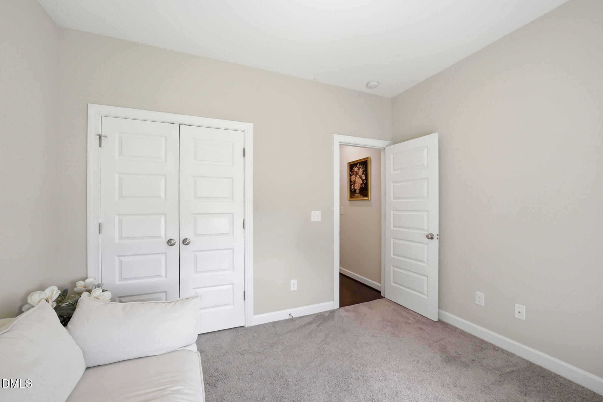 1547 Lassiter Pond Road Four Oaks, NC 27524 - Photo 27 of 45 an empty room with closet and mirror