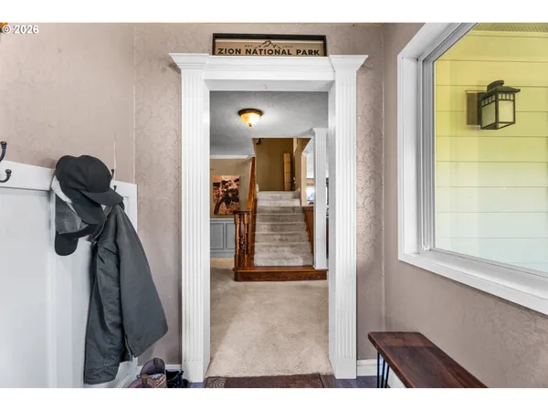 a view of a hallway with a bathroom