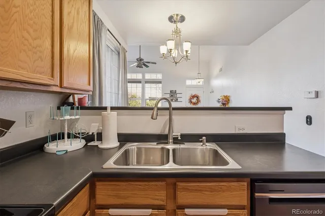 a kitchen with a sink cabinets and window