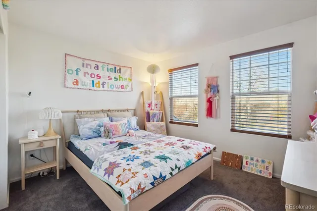 a bedroom with a bed and a table in it