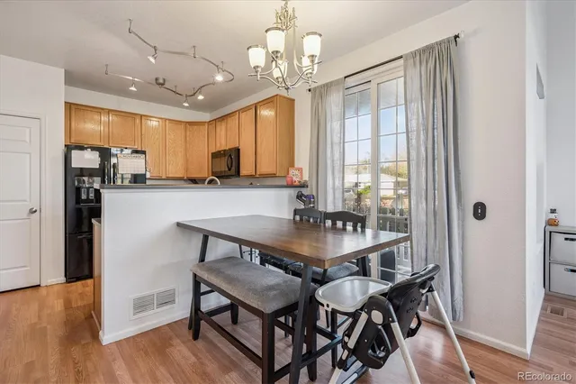 a view of a dining room with furniture window and wooden floor
