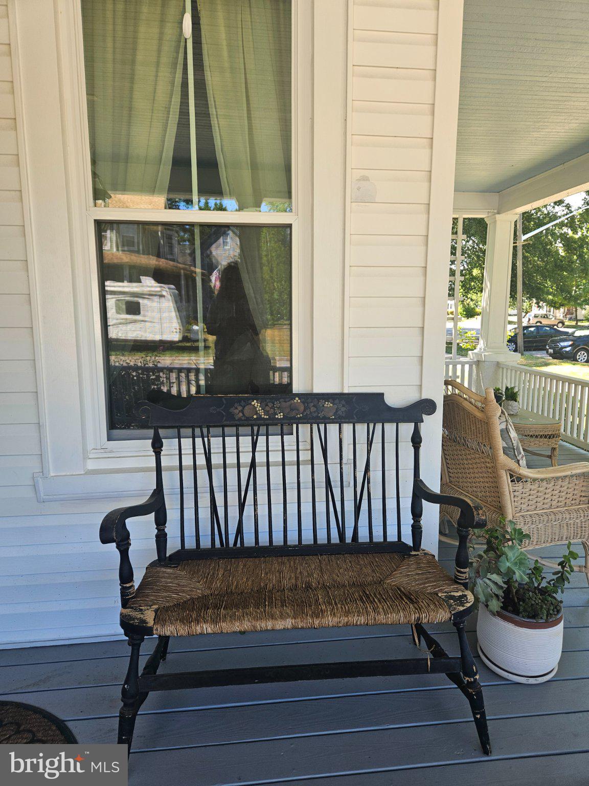 202 Central Avenue Ridgely, MD 21660 - Photo 4 of 22 Charming porch bench invites relaxation.